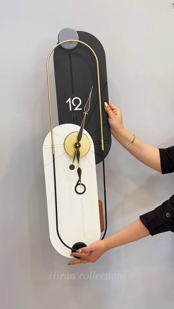 Modern Black and Gold Decorative Wall Clock - Image 3