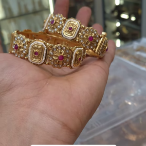 Exquisite Gold-Toned Bangles with Ruby and Pearl Accents